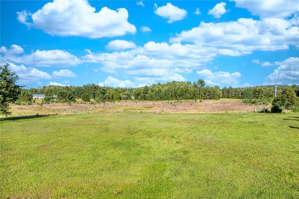 9018 North Anderson Road Hayward, WI 54843 - Photo 7 of 42 View of grassy yard with a view of countryside