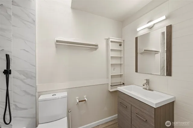 a bathroom with a sink vanity and a mirror
