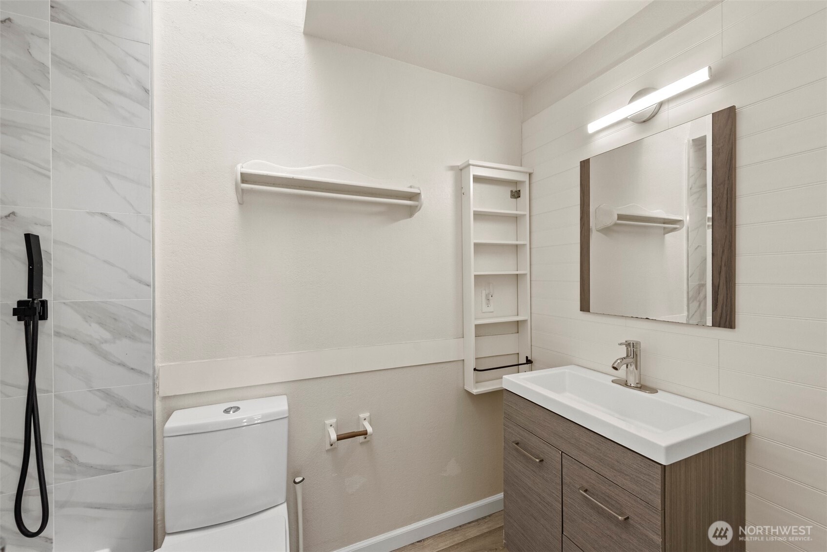 5703 134th Place Southeast, Unit A Snohomish, WA 98296 - Photo 11 of 20 a bathroom with a sink vanity and a mirror