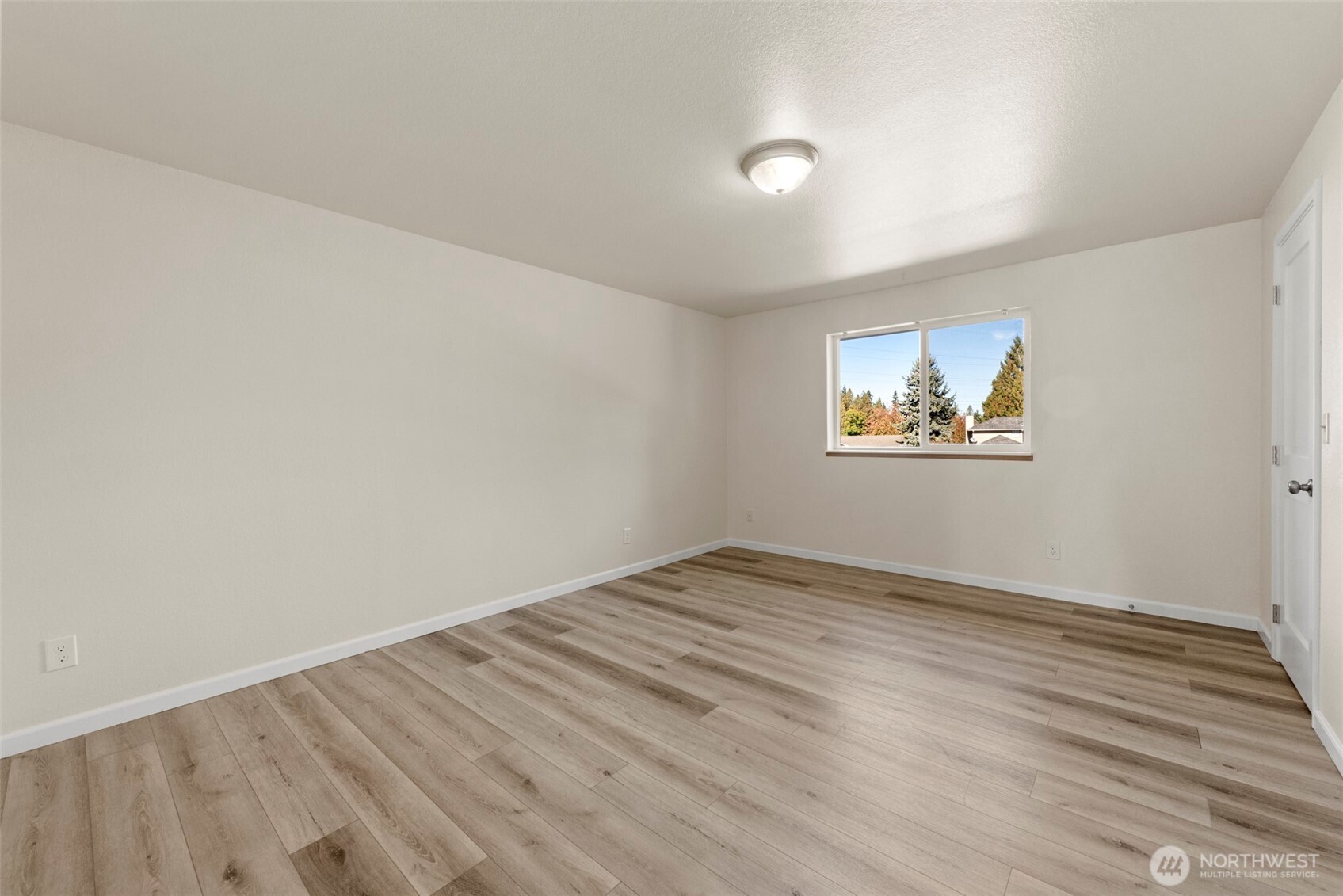 5703 134th Place Southeast, Unit A Snohomish, WA 98296 - Photo 13 of 20 a view of empty room with wooden floor