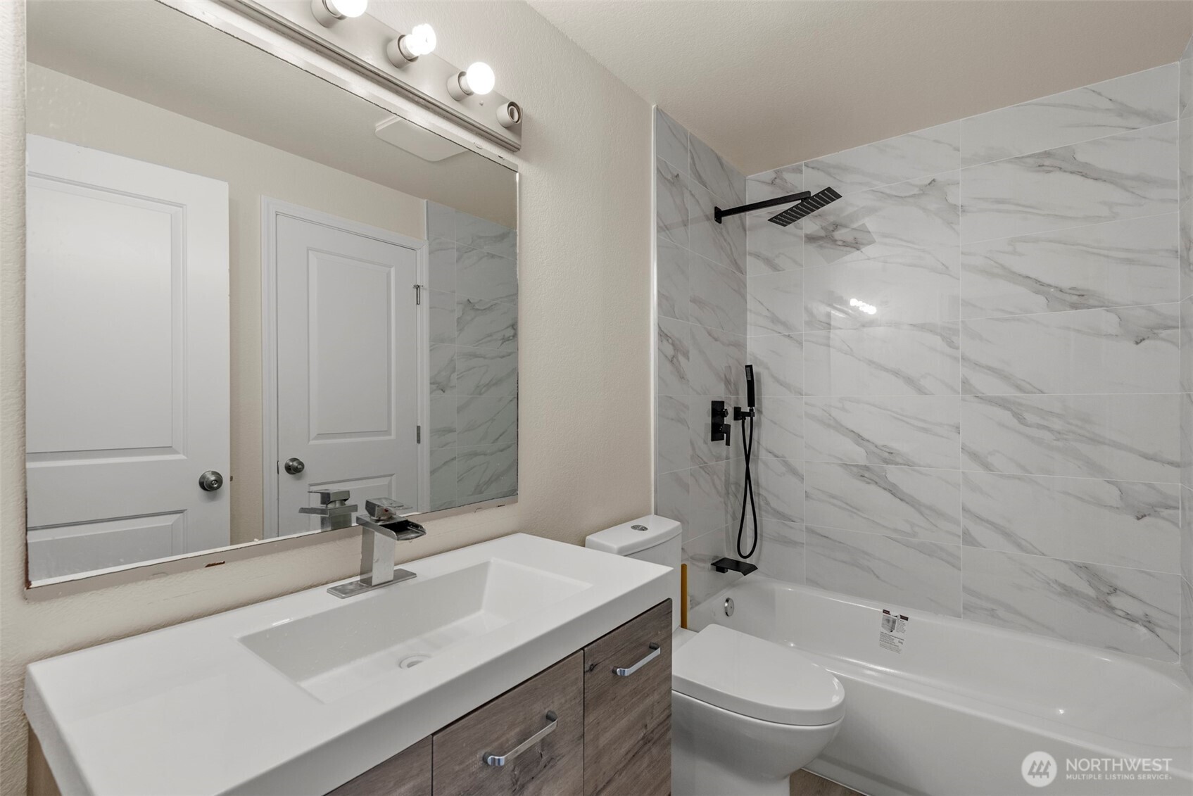 5703 134th Place Southeast, Unit A Snohomish, WA 98296 - Photo 17 of 20 a bathroom with a sink toilet tub and shower