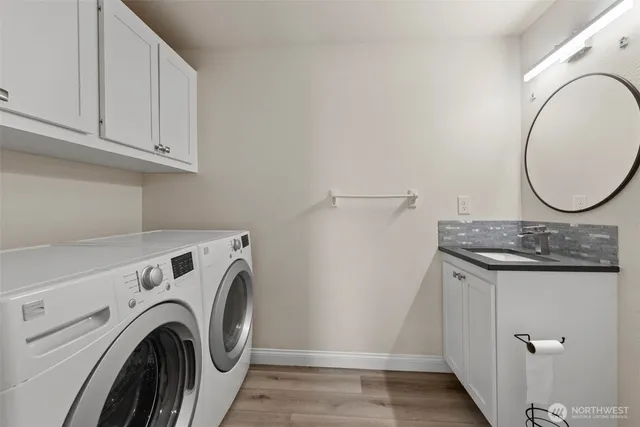 a view of storage and utility room with washer and dryer