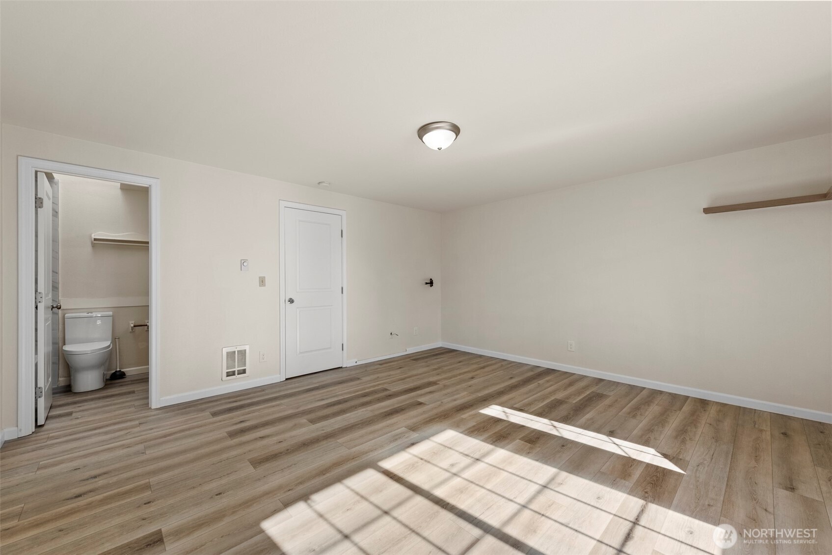 5703 134th Place Southeast, Unit A Snohomish, WA 98296 - Photo 10 of 20 wooden floor in an empty room