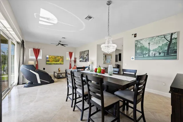 a kitchen with stainless steel appliances granite countertop a sink stove and microwave