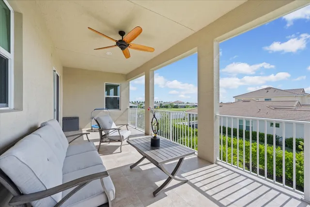 a bathroom with a granite countertop sink a toilet and a shower curtain