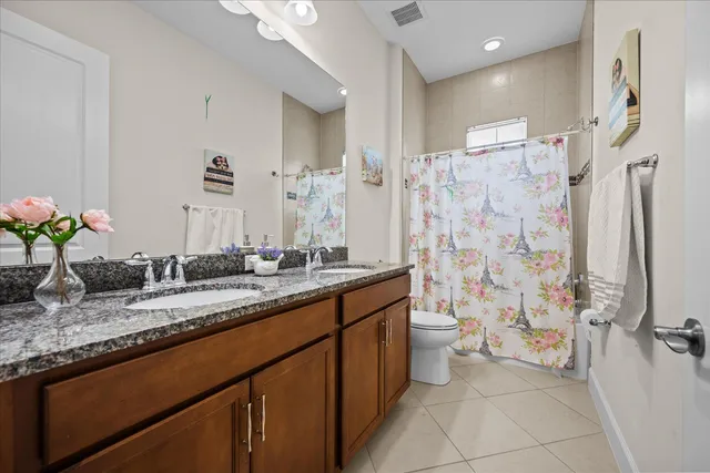 a view of a patio with a table chairs and a yard