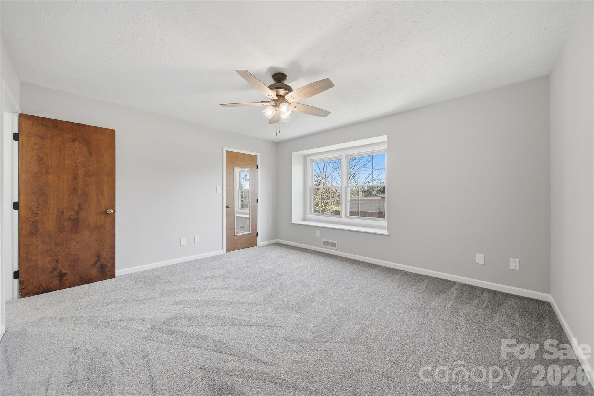 414 7th Street Northeast, Unit 2 Hickory, NC 28601 - Photo 18 of 36 a view of an empty room with a window