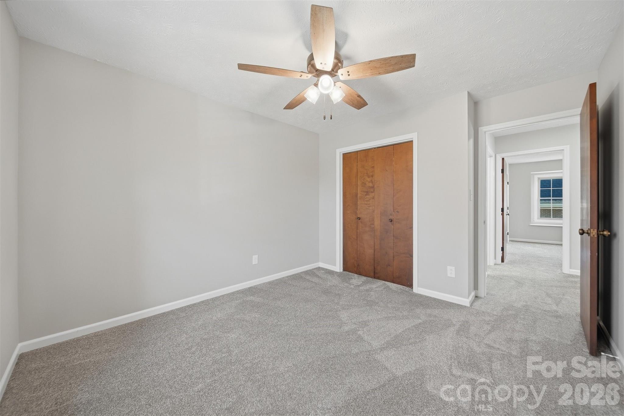 414 7th Street Northeast, Unit 2 Hickory, NC 28601 - Photo 26 of 36 a view of an empty room with a fan