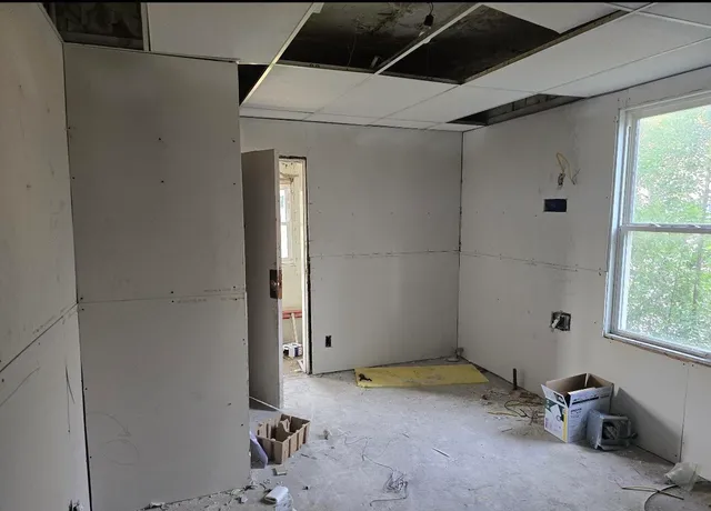 a room with window and a ceiling fan