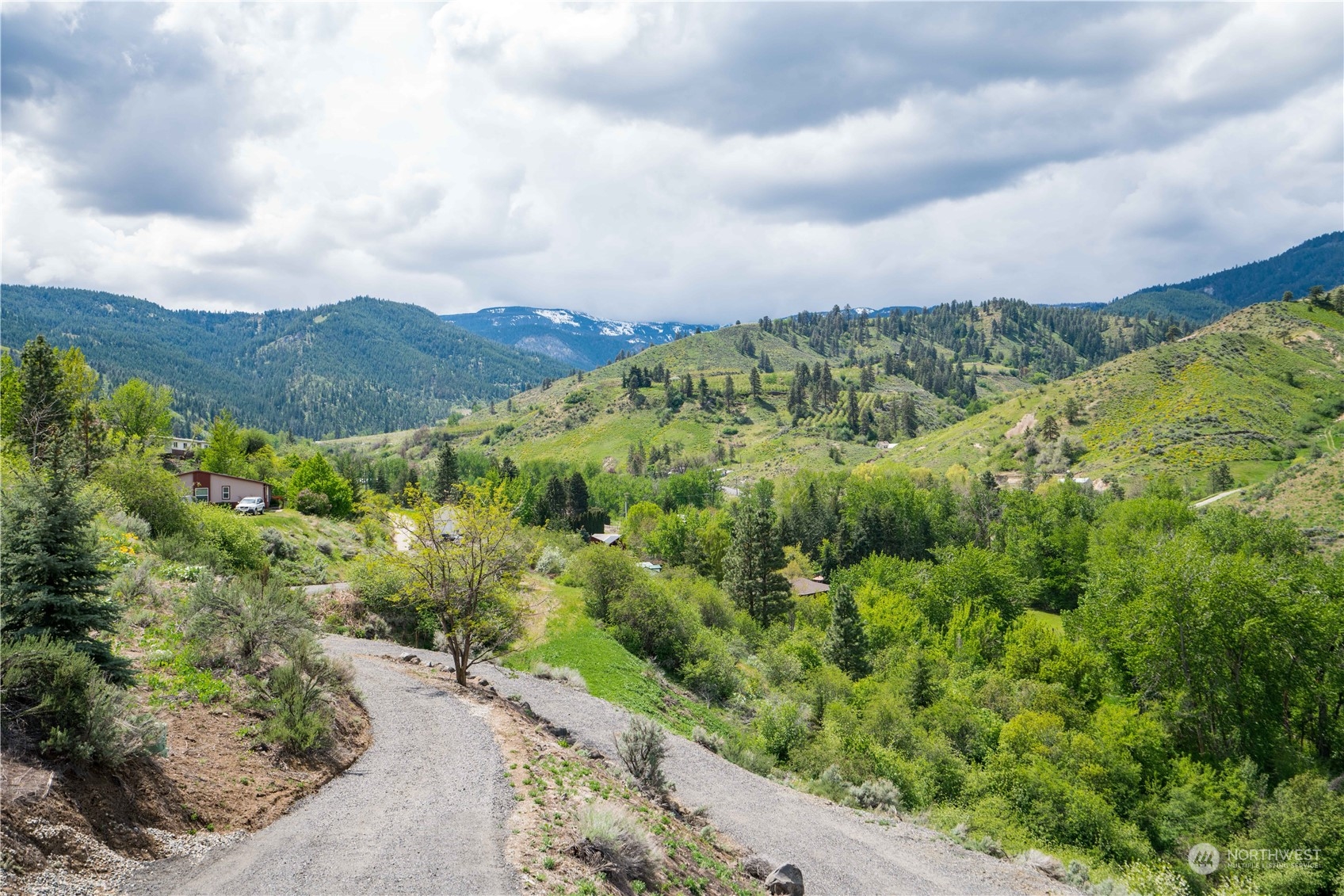 1246 Cranmer Road Wenatchee, WA 98801 - Photo 12 of 39 a view of a city with lush green forest