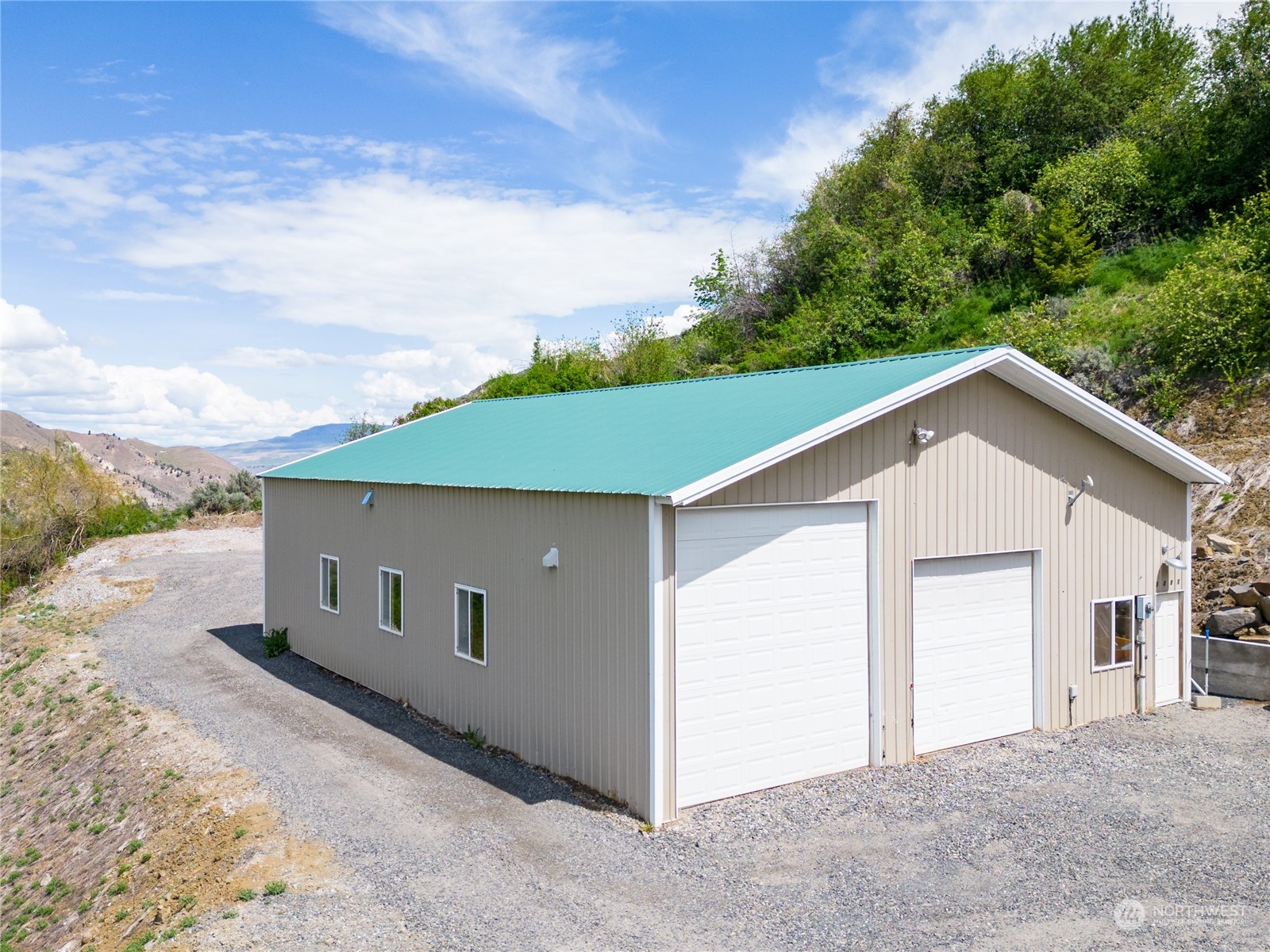 1246 Cranmer Road Wenatchee, WA 98801 - Photo 17 of 39 a front view of a house with a yard and garage