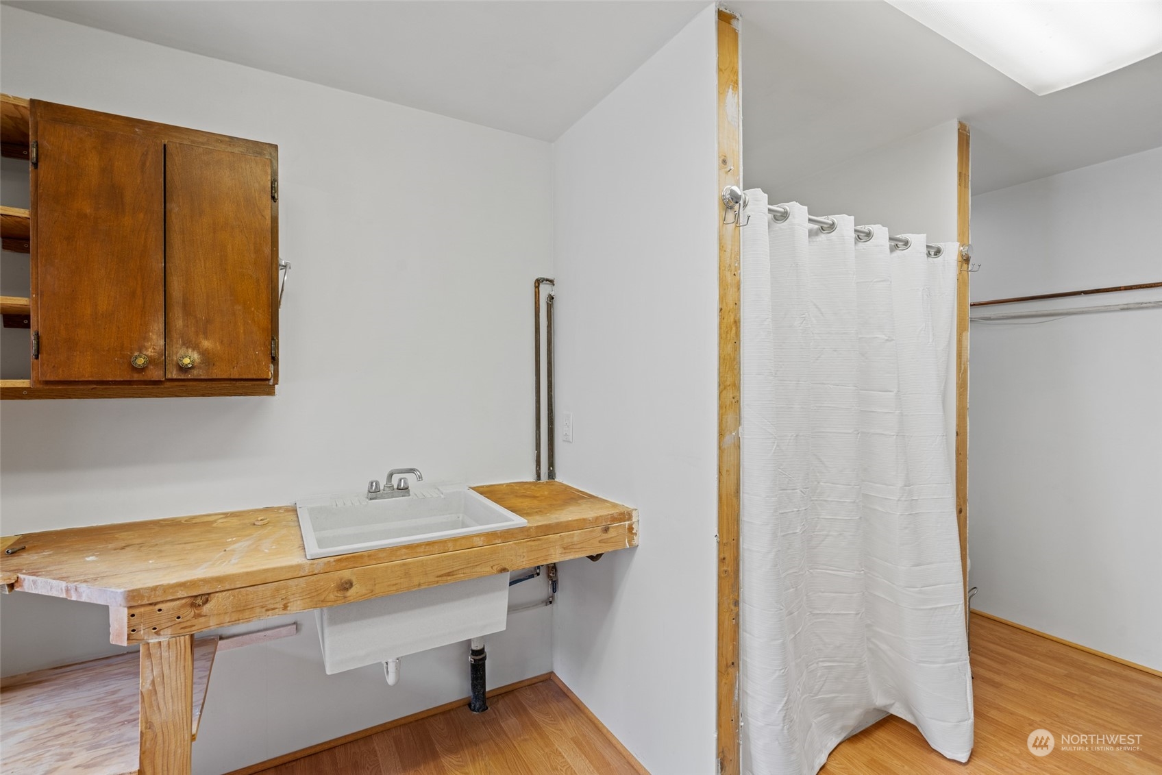 1246 Cranmer Road Wenatchee, WA 98801 - Photo 19 of 39 a room with a table and a refrigerator