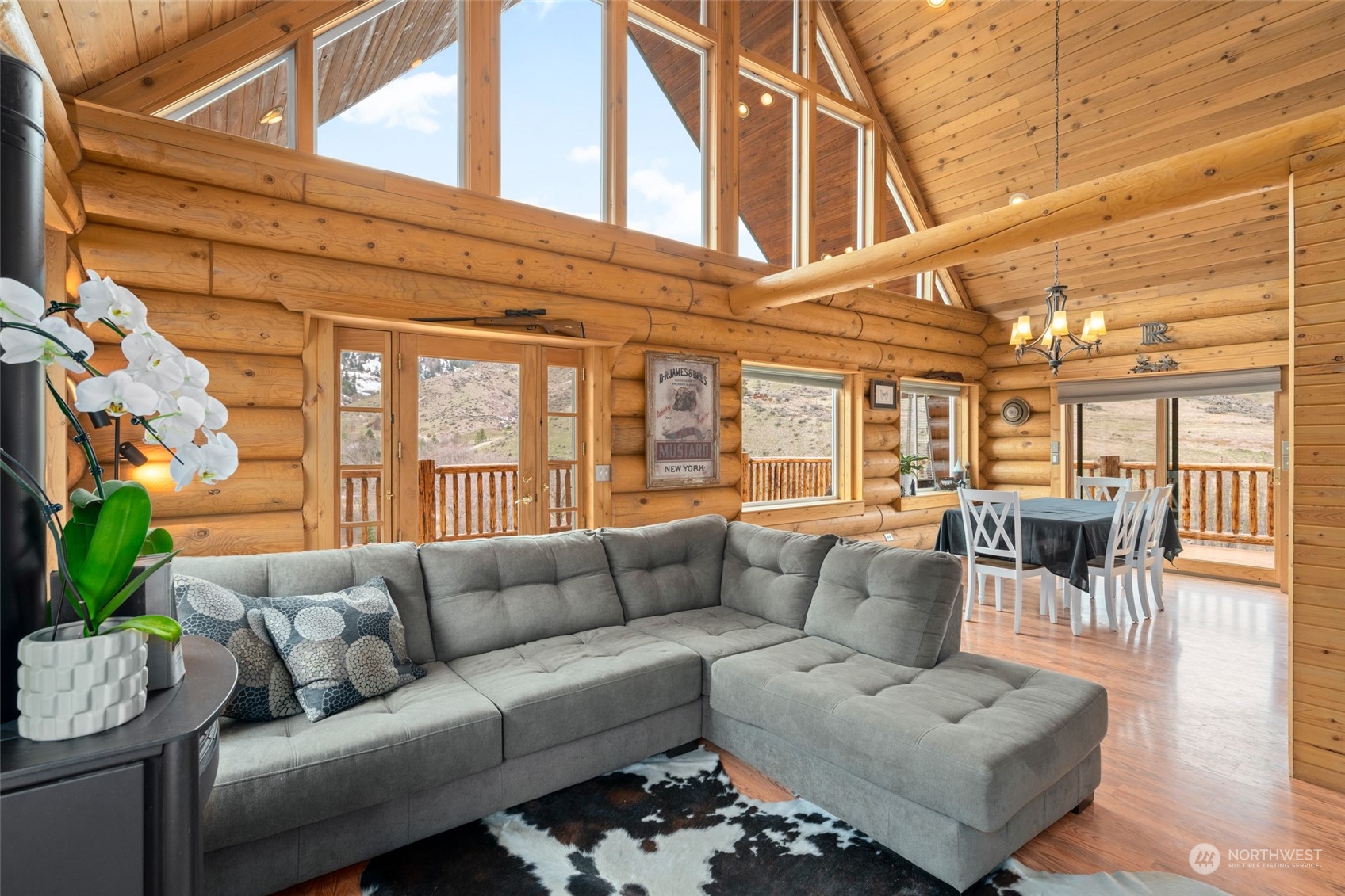 1246 Cranmer Road Wenatchee, WA 98801 - Photo 20 of 39 a living room with furniture a dining table and a potted plant