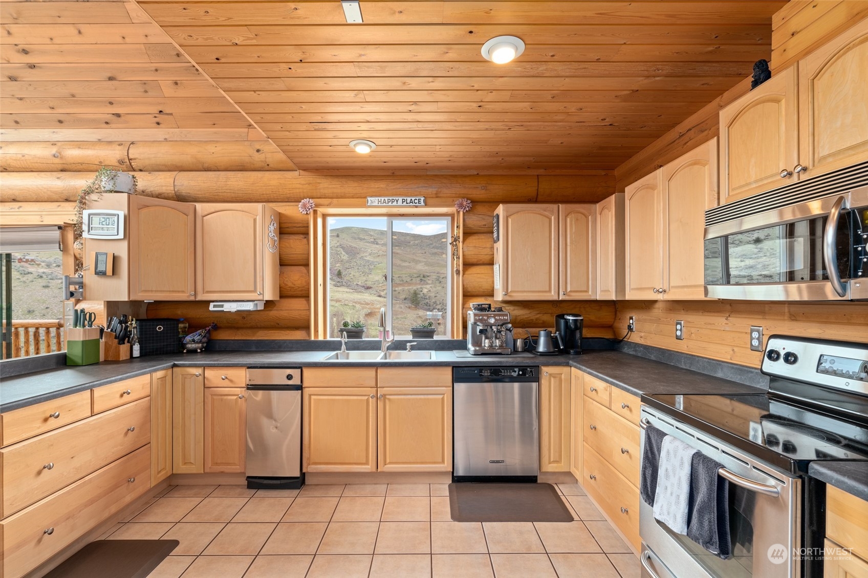 1246 Cranmer Road Wenatchee, WA 98801 - Photo 23 of 39 a kitchen with a sink stove and cabinets