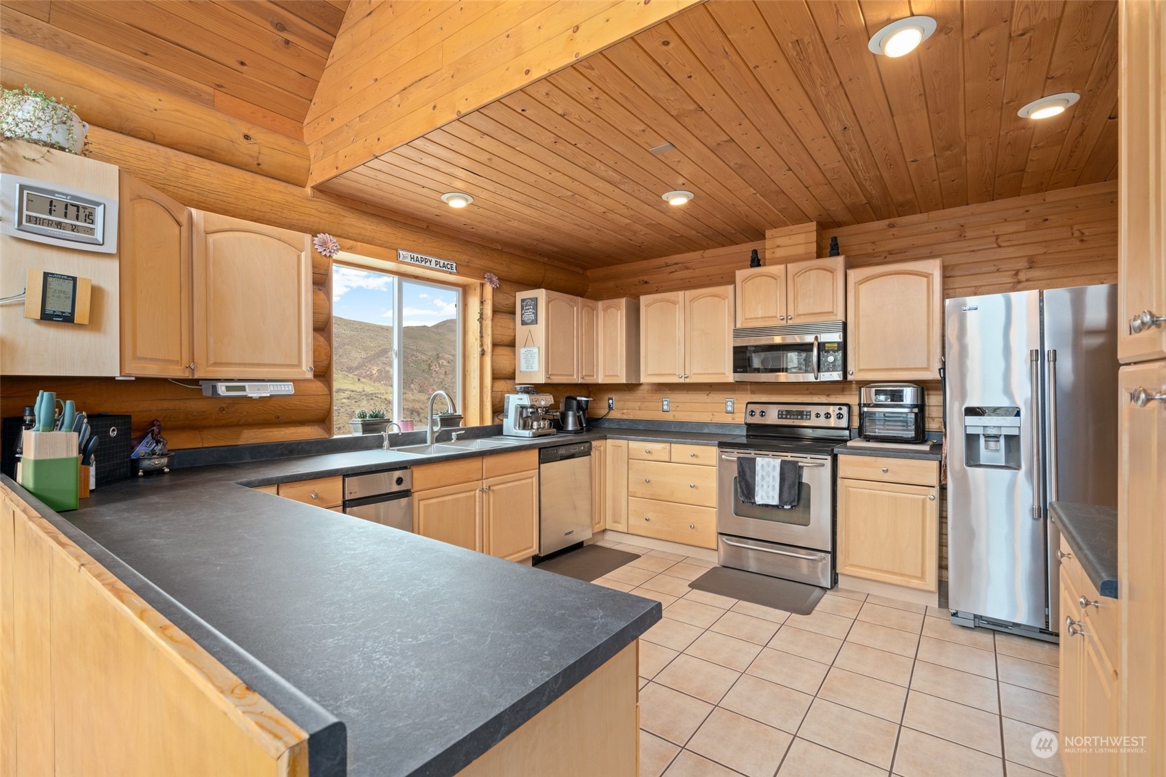 1246 Cranmer Road Wenatchee, WA 98801 - Photo 24 of 39 a kitchen with a sink stainless steel appliances furniture cabinets and a counter top space