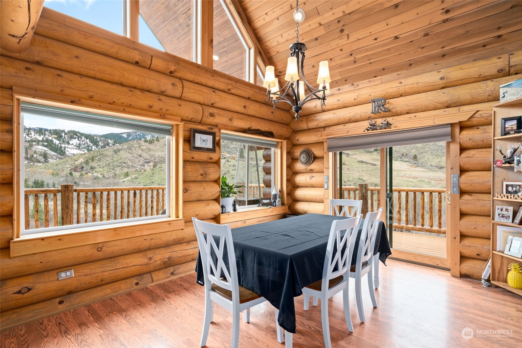 1246 Cranmer Road Wenatchee, WA 98801 - Photo 25 of 39 a view of a dining room with furniture a chandelier and wooden floor