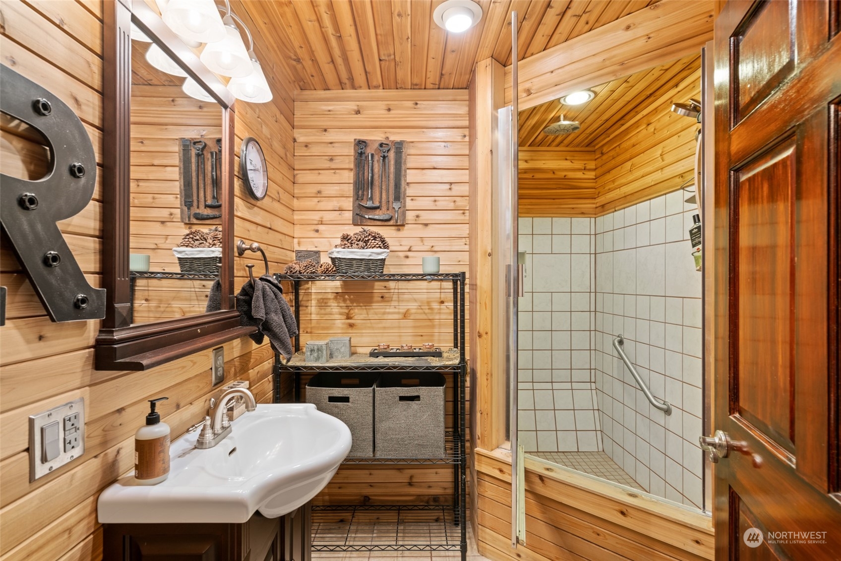 1246 Cranmer Road Wenatchee, WA 98801 - Photo 37 of 39 a bathroom with a sink a mirror and shower