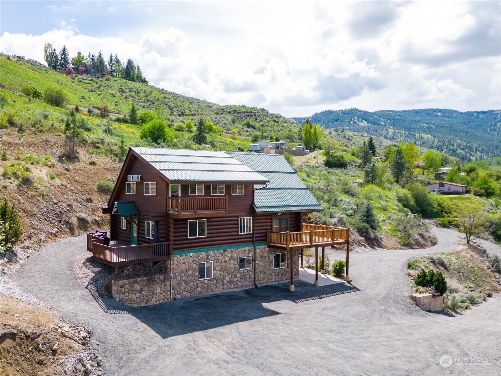 1246 Cranmer Road Wenatchee, WA 98801 - Photo 9 of 39 an aerial view of a house with a yard and balcony