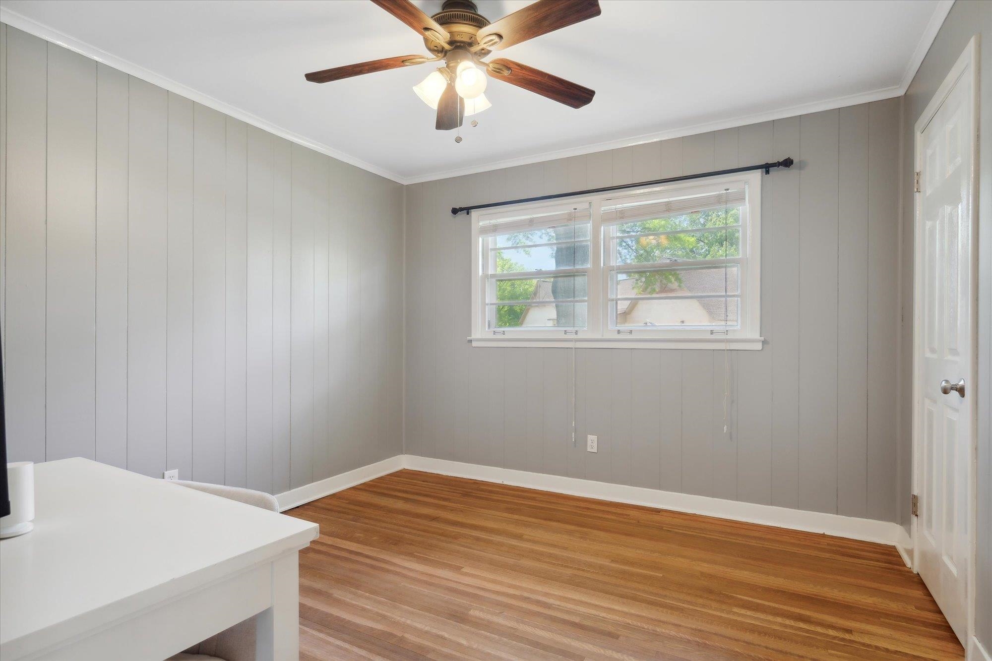 336 McElroy Road Memphis, TN 38120 - Photo 15 of 26 Spare room featuring ceiling fan, light wood-type flooring, and crown molding