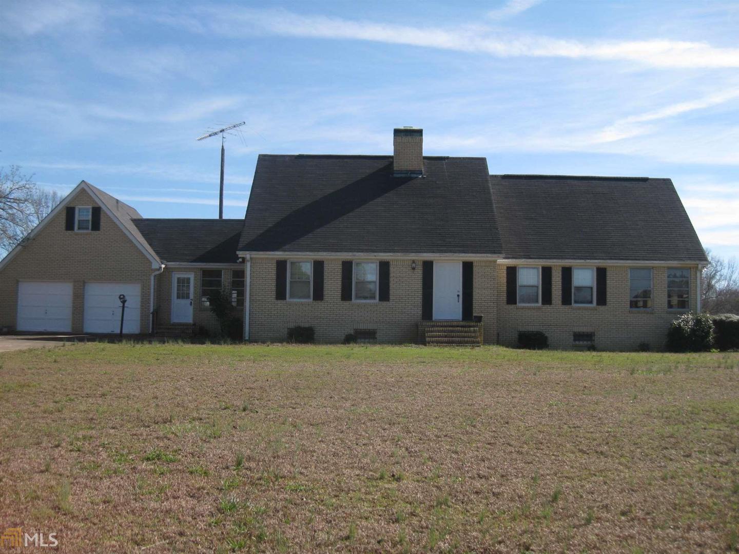 840 Jones Road Molena, GA 30258 - Photo 1 of 1 a house that has a large tree in front of it