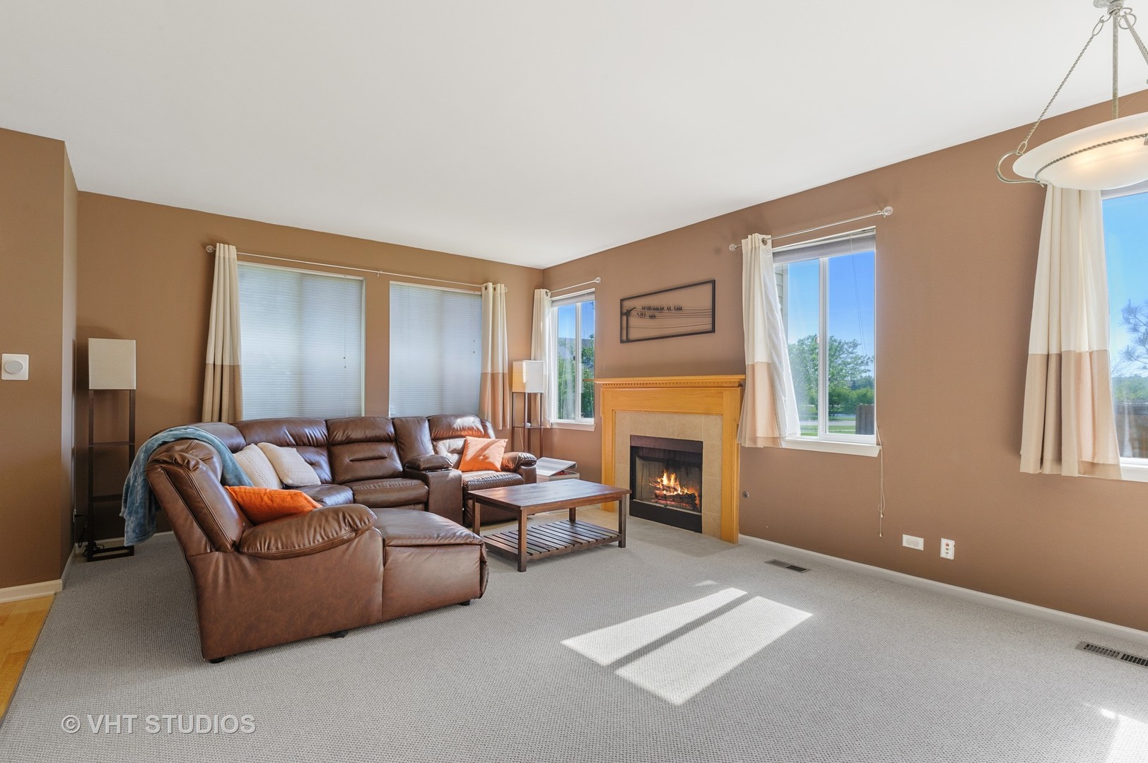 1858 South Fallbrook Drive Round Lake, IL 60073 - Photo 2 of 10 a living room with furniture and a fireplace