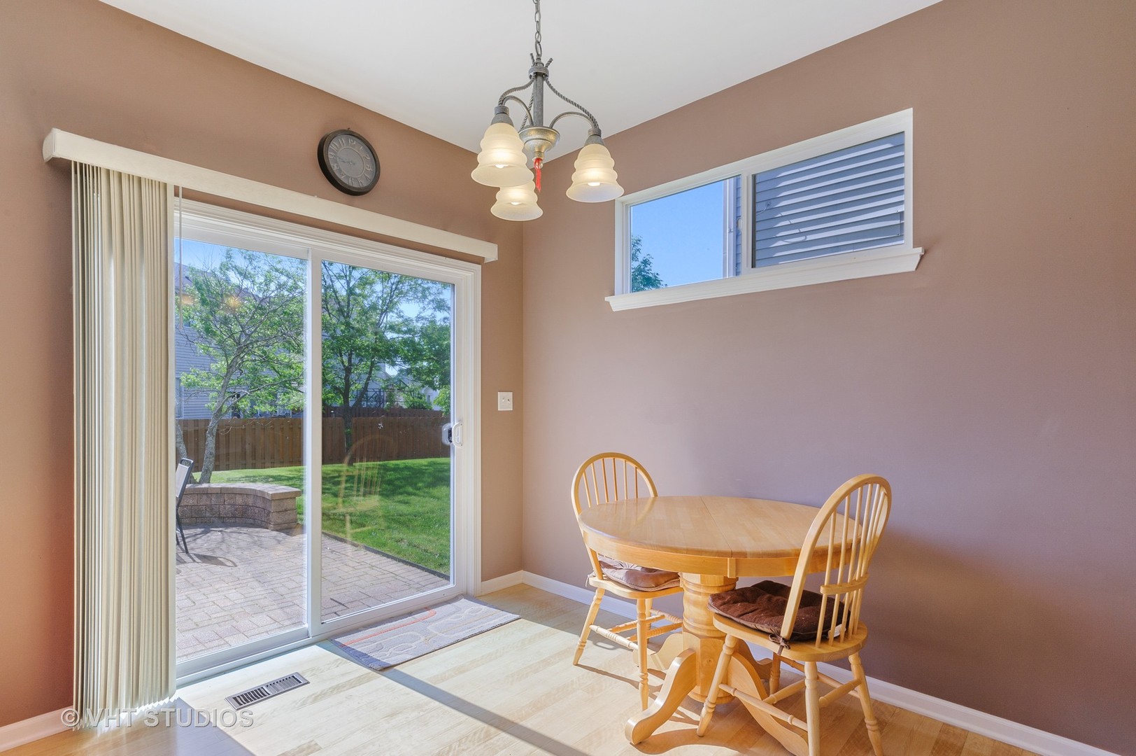 1858 South Fallbrook Drive Round Lake, IL 60073 - Photo 5 of 10 a view of a dining room with furniture and chandelier