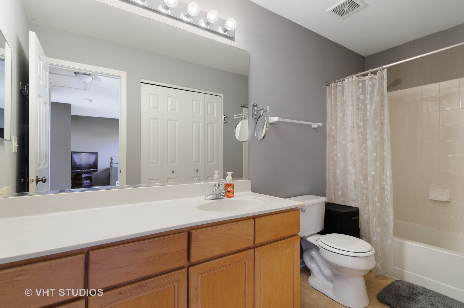 1858 South Fallbrook Drive Round Lake, IL 60073 - Photo 9 of 10 a bathroom with a sink toilet vanity and shower