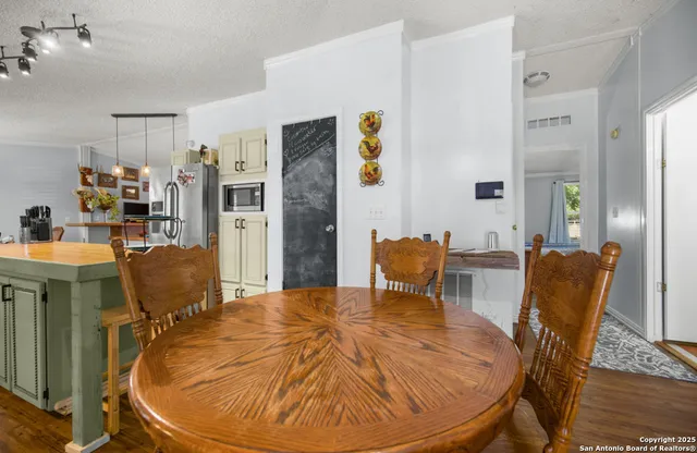 a view of a dining room with furniture