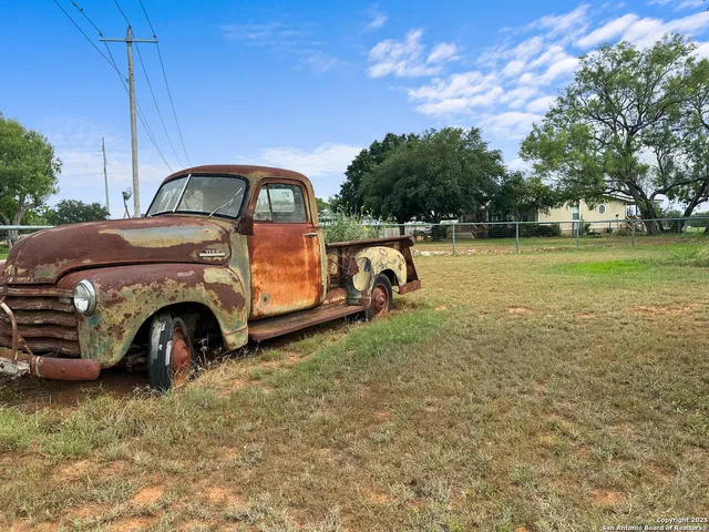 a view of yard with car parked