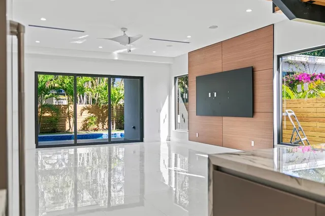 a bathroom with a double vanity sink and large mirror