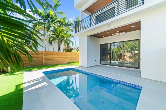 a view of an outdoor space and a front view of a house