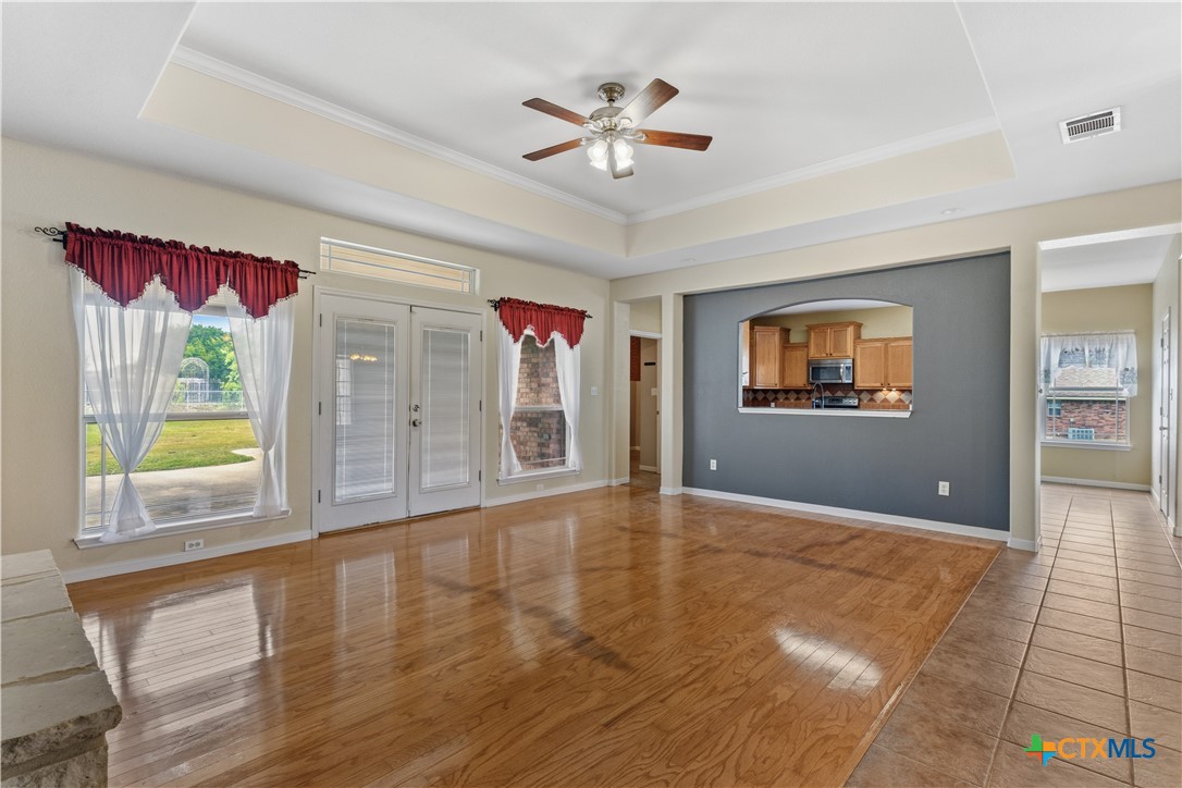 283 County Road 4710 Kempner, TX 76539 - Photo 7 of 47 a view of an empty room with a window and a kitchen