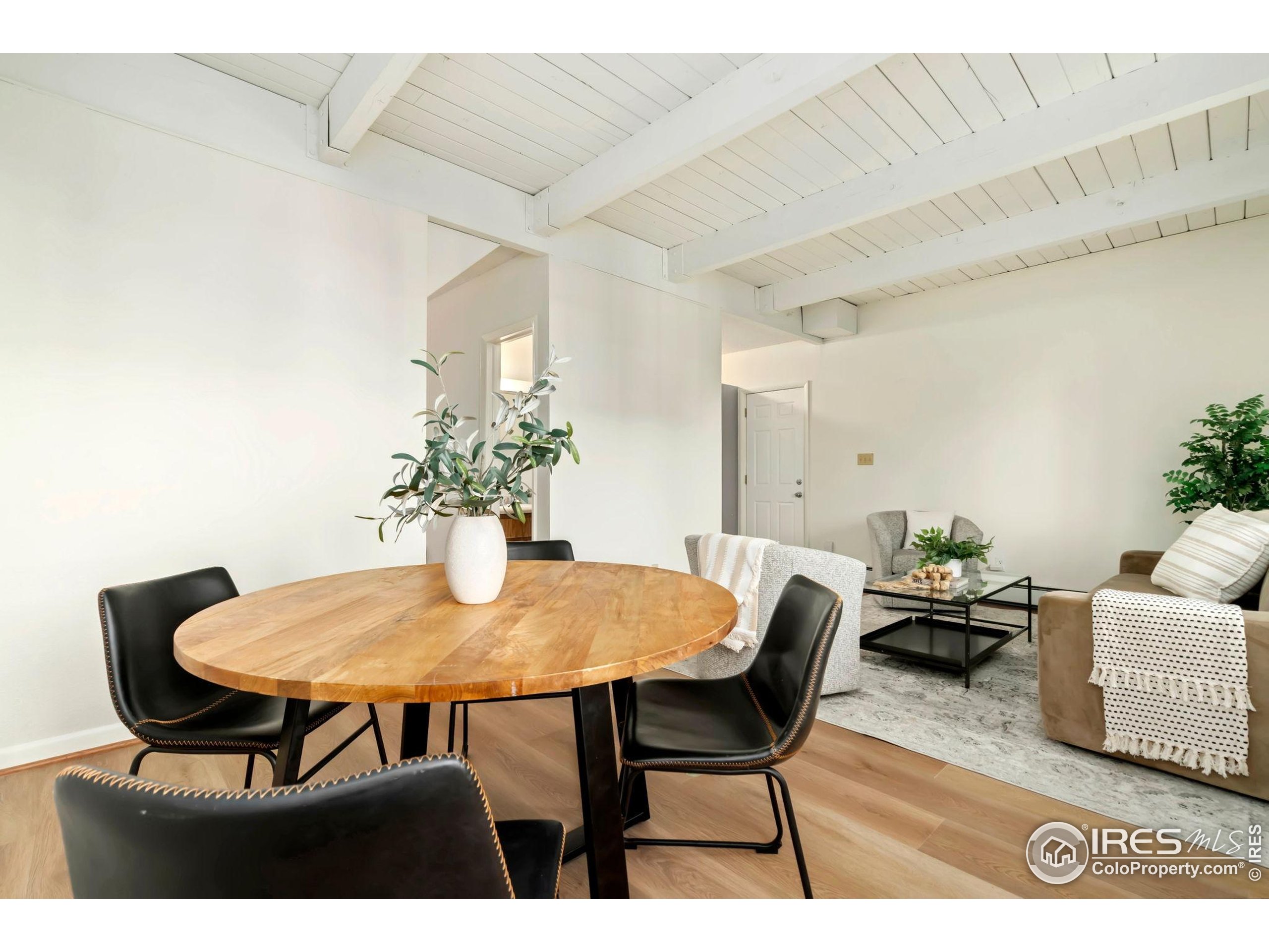 1737 Springmeadows Court, Unit A Fort Collins, CO 80525 - Photo 8 of 20 a dining room with furniture and wooden floor