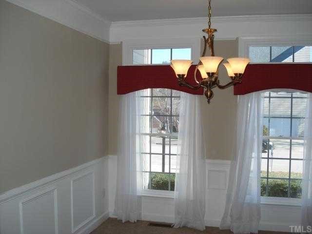 8829 Breeland Way Raleigh, NC 27613 - Photo 3 of 12 a view of a house with a dining table and chairs