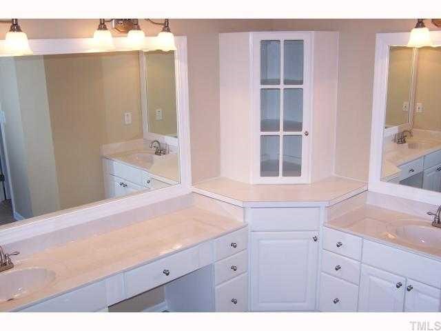 8829 Breeland Way Raleigh, NC 27613 - Photo 7 of 12 a bathroom with a sink vanity granite tub and shower