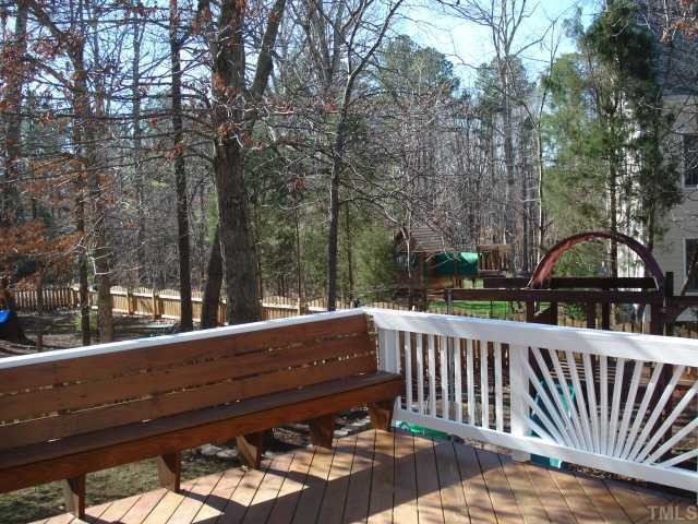 8829 Breeland Way Raleigh, NC 27613 - Photo 10 of 12 a view of a wooden bench on the roof