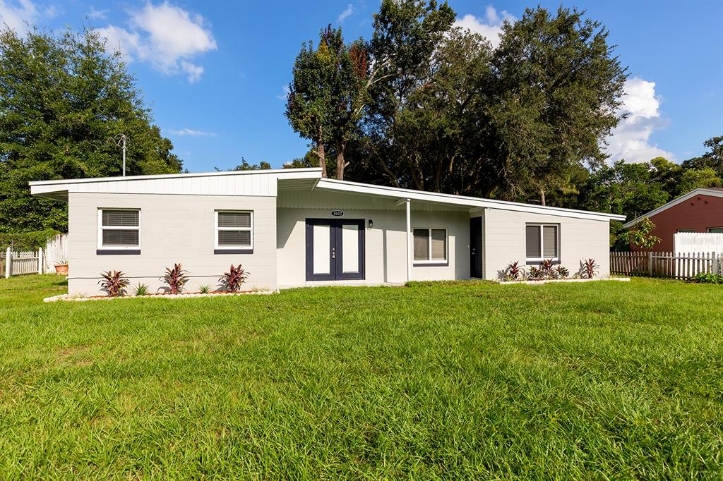 1007 San Domingo Road Orlando, FL 32808 - Photo 1 of 17 a view of a house with backyard and garden