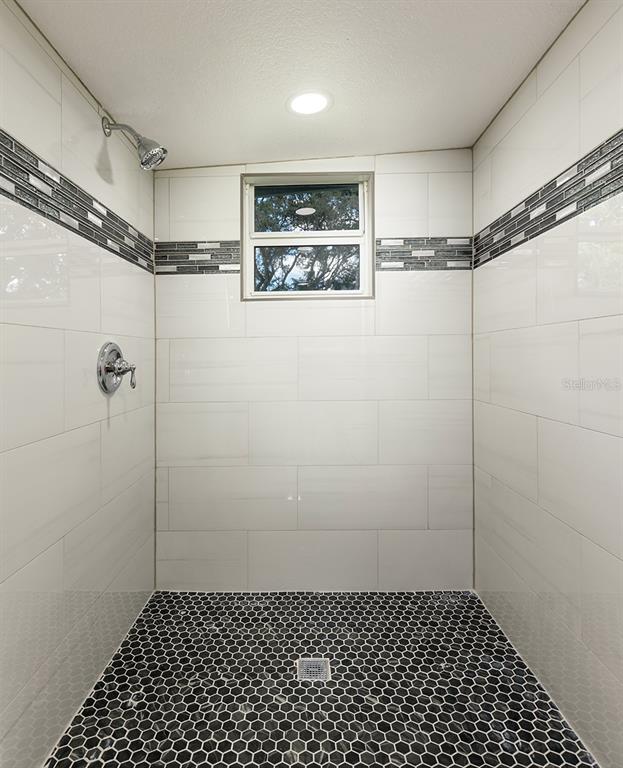 1007 San Domingo Road Orlando, FL 32808 - Photo 14 of 17 a bathroom with a shower