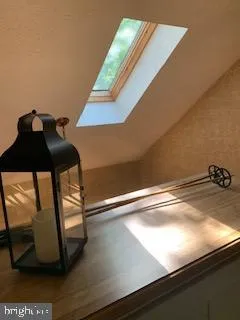 a bedroom with bed and a night stand