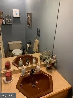 a bathroom with a sink and mirror