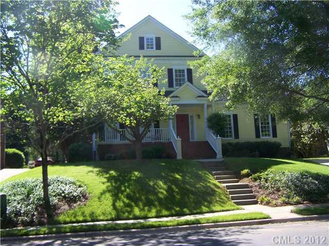 241 Kimberly Road Davidson, NC 28036 - Photo 1 of 16 a front view of a house with a yard and trees