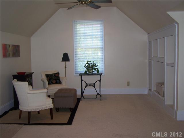 241 Kimberly Road Davidson, NC 28036 - Photo 12 of 16 a living room with furniture and a potted plant