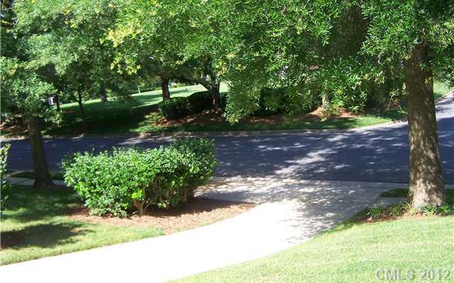 241 Kimberly Road Davidson, NC 28036 - Photo 13 of 16 a backyard of a house with lots of green space