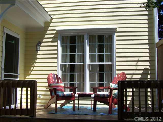 241 Kimberly Road Davidson, NC 28036 - Photo 14 of 16 a front view of a house with outdoor seating