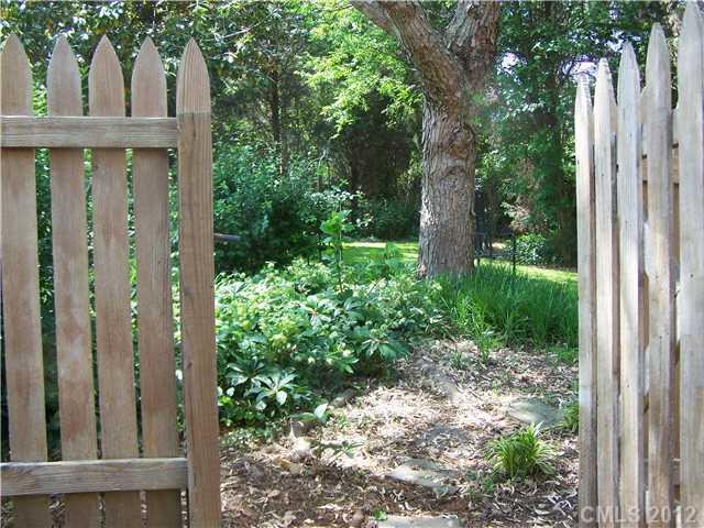 241 Kimberly Road Davidson, NC 28036 - Photo 16 of 16 a view of a backyard with plants