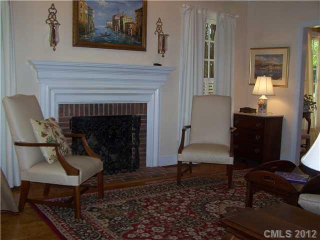 241 Kimberly Road Davidson, NC 28036 - Photo 4 of 16 a living room with furniture and a fireplace