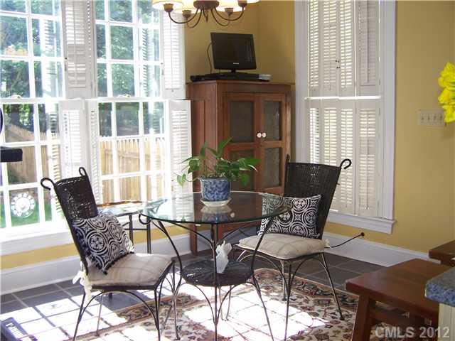 241 Kimberly Road Davidson, NC 28036 - Photo 7 of 16 a view of a dining room with furniture and wooden floor