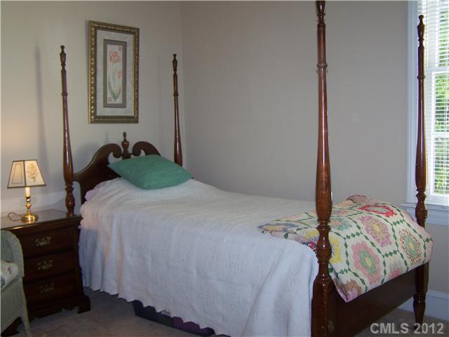 241 Kimberly Road Davidson, NC 28036 - Photo 10 of 16 a bedroom with a bed and a window