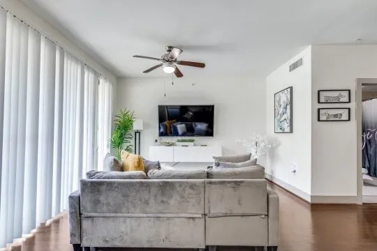 a living room with furniture and a flat screen tv