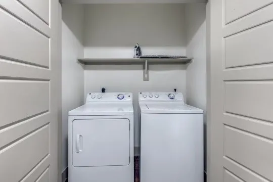 a utility room with dryer and washer